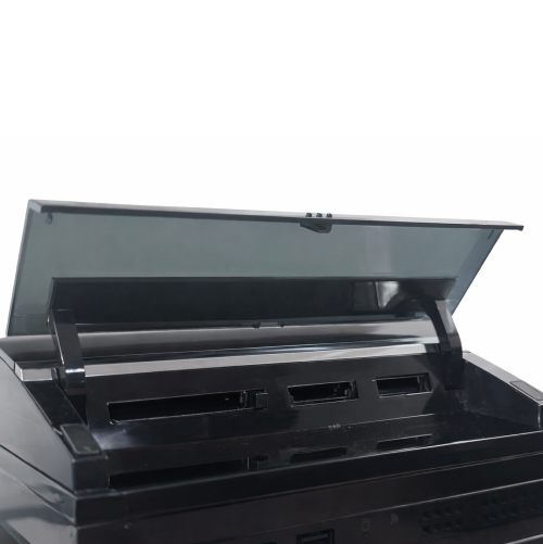 Black PlayStation 3 memory card reader with open lid on a white background