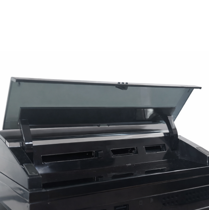 Black PlayStation 3 memory card reader with open lid on a white background